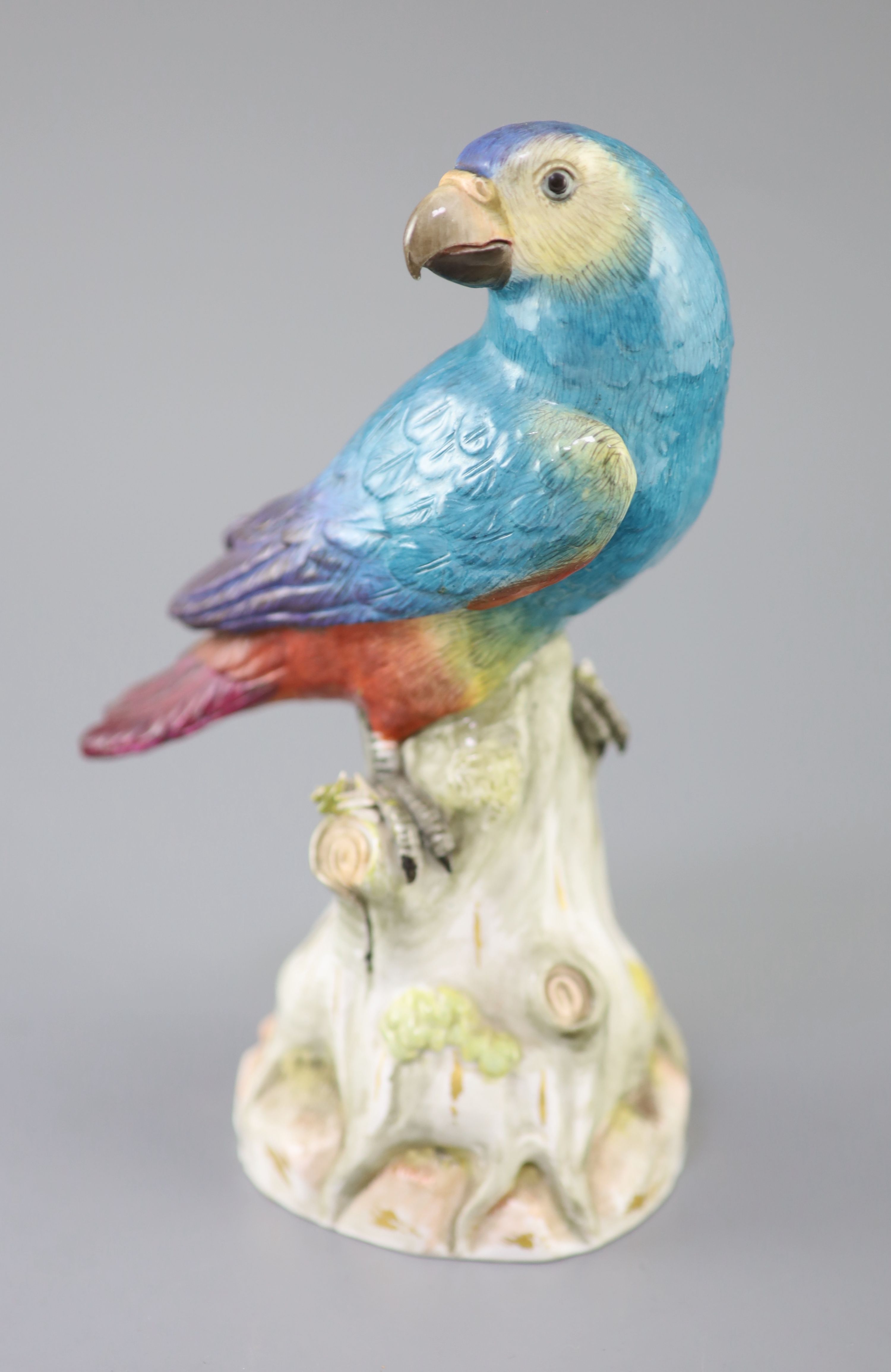 A Meissen model of a parrot seated on a tree stump, late 19th century, 22cm high